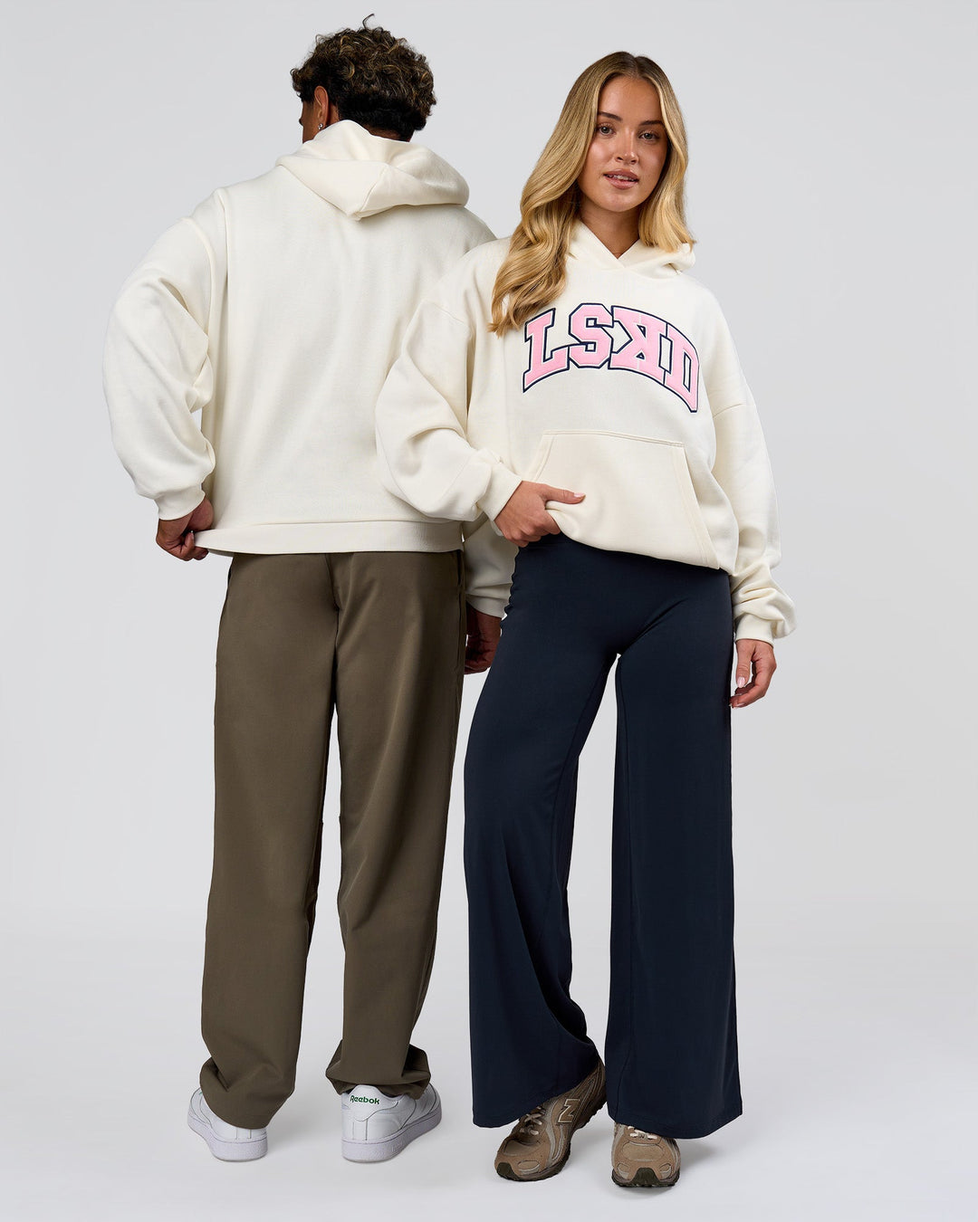 Duo wearing Varsity Boxy Hoodie - Off White-Pink Rose | Model:Issy | Size:XS | Model:Xav | Size:L - view 2