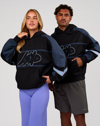 Duo wearing Vibe Oversized Hoodie - Black-Future Navy | Model:Issy | Size:XS | Model:Xav | Size:L | Thumbnail Index: 0