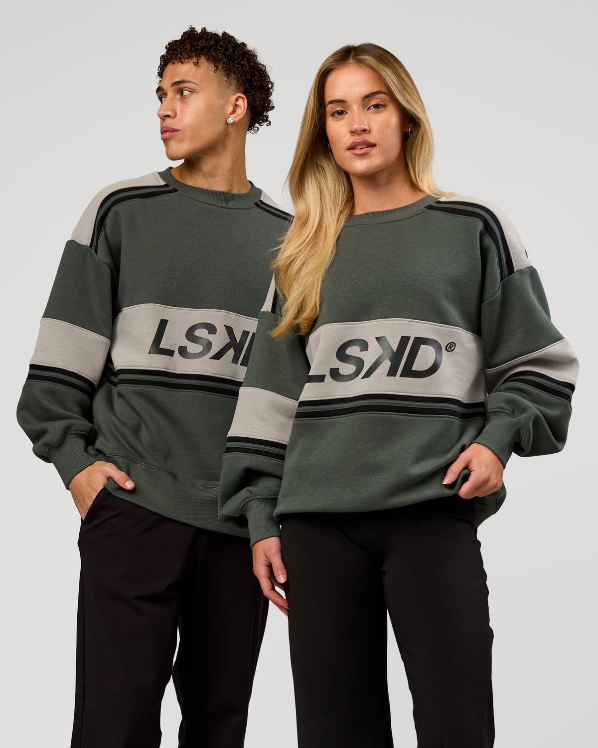 Duo wearing A-Team Sweater Oversize - Carbon Green-Alloy | Model:Issy | Size:XS | Model:Leandro | Size:M - view 1