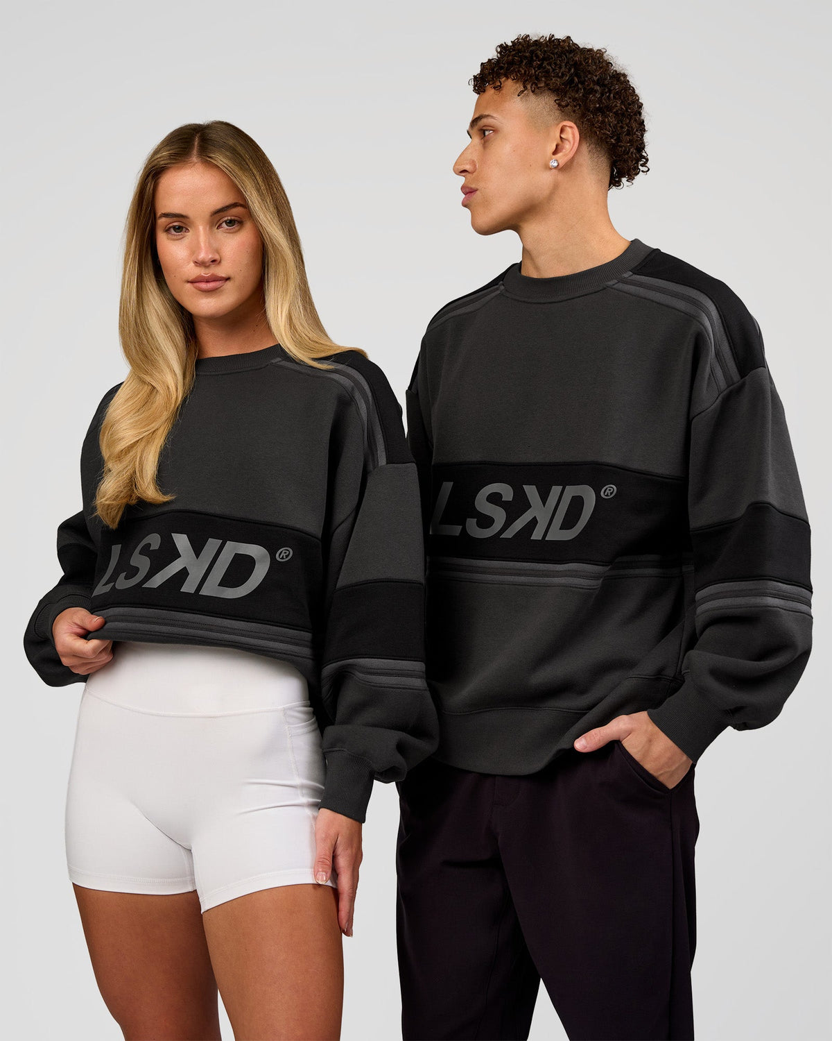 Duo wearing A-Team Sweater Oversize - Onyx-Black | Model:Issy | Size:XS | Model:Leandro | Size:M - view 1