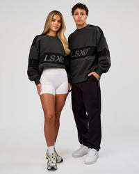 Duo wearing A-Team Sweater Oversize - Onyx-Black | Model:Issy | Size:XS | Model:Leandro | Size:M | Thumbnail Index: 3