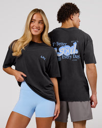 Duo wearing Blended FLXCotton Oversize Tee  - Black Washed | Model:Issy | Size:XS | Model:Leandro | Size:M | Thumbnail Index: 0