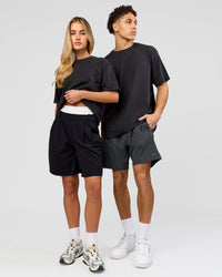 Duo wearing Benchmark FLXCotton Oversized Tee - Onyx-Yellow Fizz | Model:Issy | Size:XS | Model:Leandro | Size:M | Thumbnail Index: 4