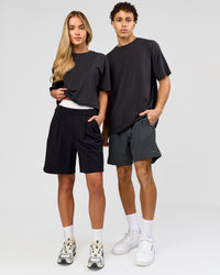 Duo wearing Benchmark FLXCotton Oversized Tee - Onyx-Yellow Fizz | Model:Issy | Size:XS | Model:Leandro | Size:M | Thumbnail Index: 3