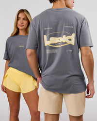 Duo wearing Magma FLXCotton Oversize Tee  - Dark Storm Washed-Lemon | Model:Issy | Size:XS | Model:Leandro | Size:M | Thumbnail Index: 0
