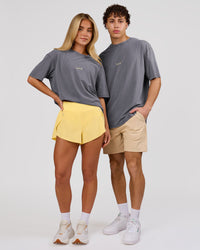Duo wearing Magma FLXCotton Oversize Tee  - Dark Storm Washed-Lemon | Model:Issy | Size:XS | Model:Leandro | Size:M | Thumbnail Index: 3