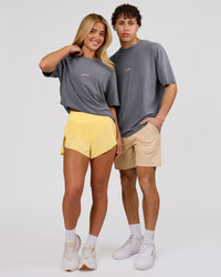 Duo wearing Magma FLXCotton Oversize Tee  - Dark Storm Washed-Lemon | Model:Issy | Size:XS | Model:Leandro | Size:M | Thumbnail Index: 6