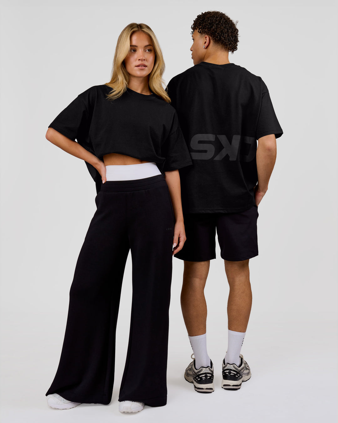 Duo wearing Shadow Mark Heavyweight Oversized Tee - Black-Onyx | Model:Issy | Size:XS | Model:Leandro | Size:M - view 10