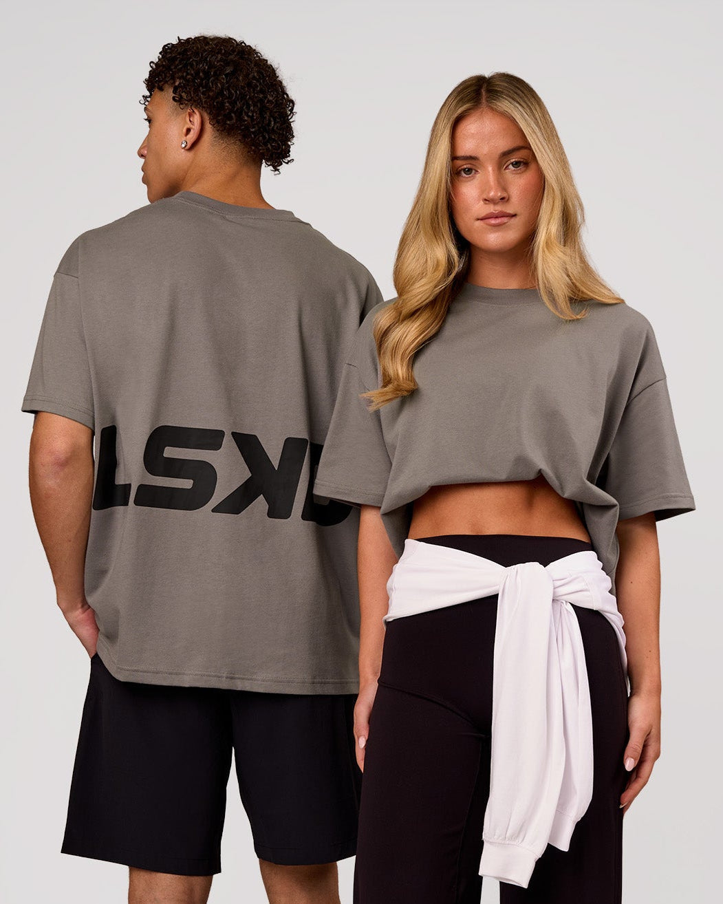 Duo wearing Shadow Mark Heavyweight Oversized Tee - Storm Front-Onyx | Model:Issy | Size:XS | Model:Leandro | Size:M