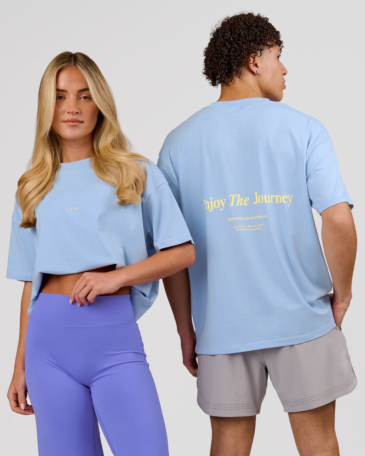 Duo wearing VS26 Journey FLXCotton Oversize Tee - Open Air-Lemon | Model:Issy | Size:XS | Model:Leandro | Size:M - view 1