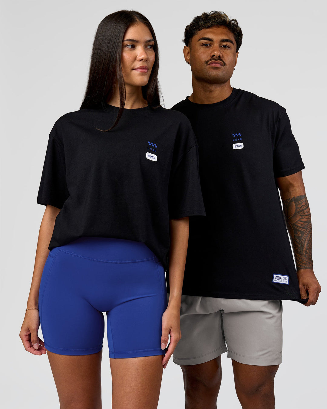 Duo wearing Archive FLXCotton Oversized Tee - Black-Electric Indigo | Model:Rhiley | Size:XS | Model:Xav | Size:L - view 6
