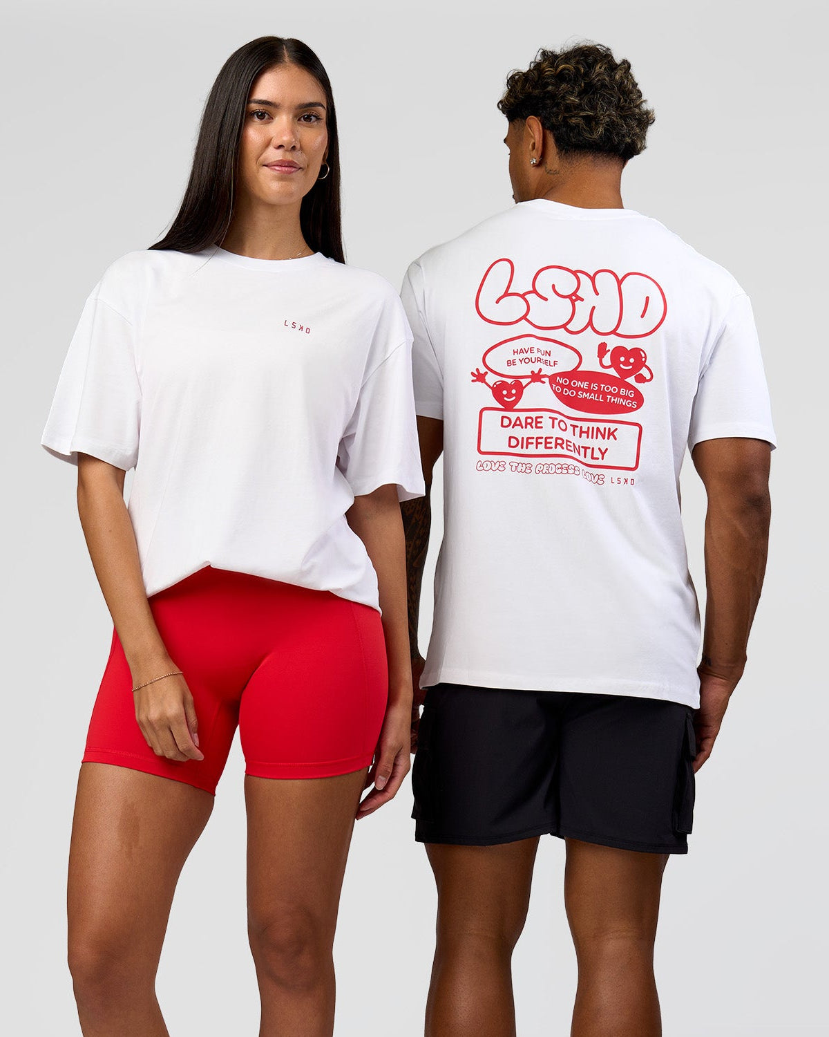 Duo wearing Dare To Think FLXCotton Tee Oversize - White-Scarlet | Model:Rhiley | Size:XS | Model:Xav | Size:L