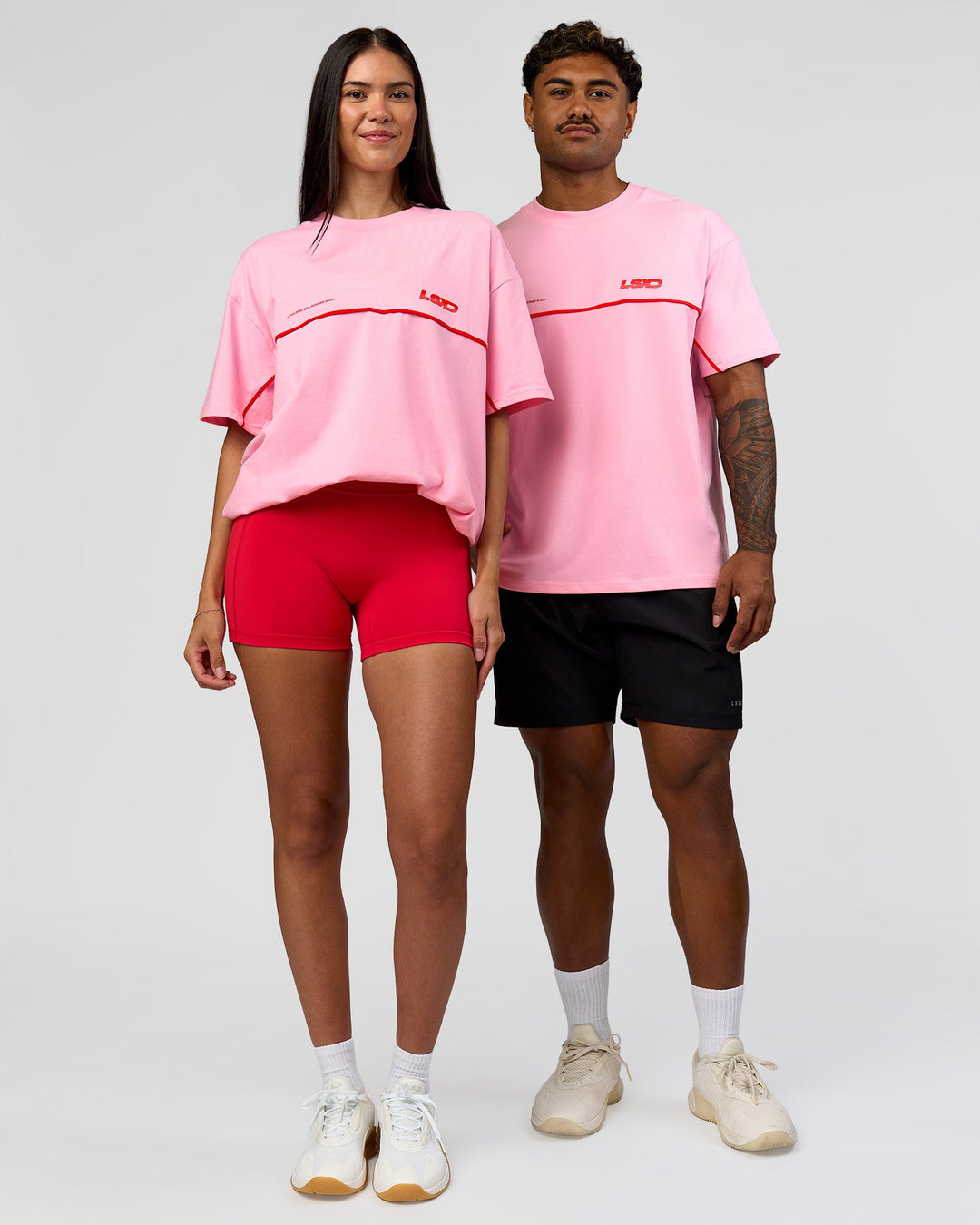 Duo wearing Inline Heavyweight FLXCotton Oversized Tee - Pink Rose-Flame | Model:Rhiley | Size:XS | Model:Xav | Size:L - view 7