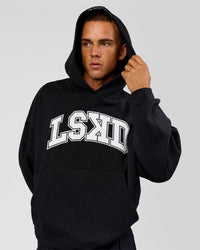 Man wearing Varsity Boxy Hoodie - Caviar-White | Model:Albert | Size:L