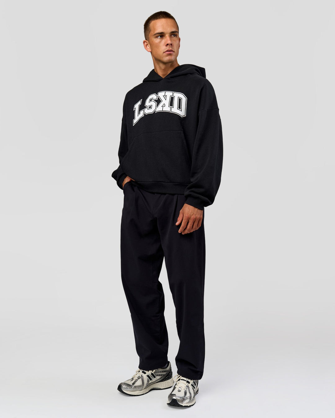 Man wearing Varsity Boxy Hoodie - Caviar-White | Model:Albert | Size:L