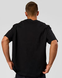 Man wearing Varsity EST Heavyweight Oversized Tee  - Black-Off White | Model:Albert | Size:L | Thumbnail Index: 5