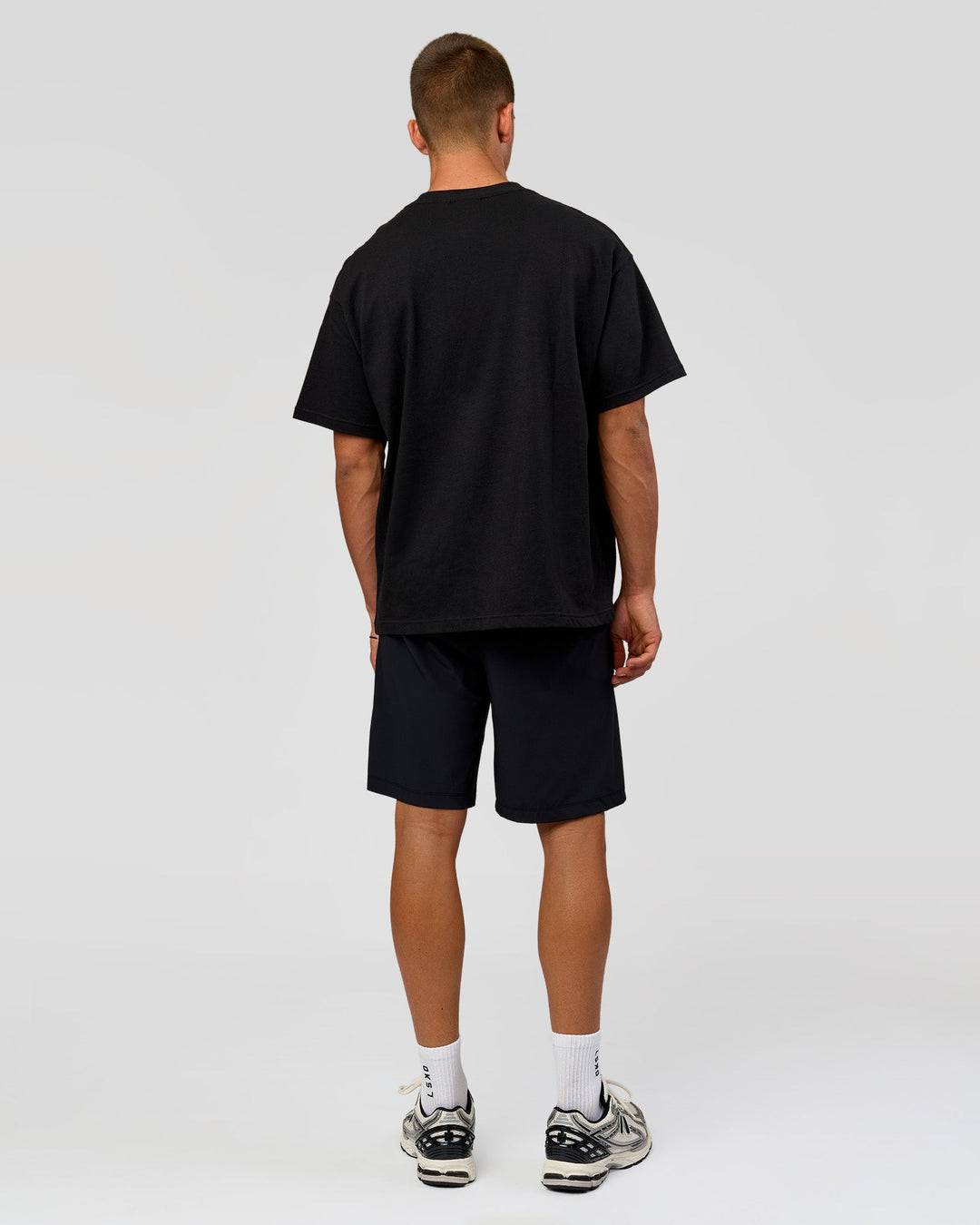 Man wearing Varsity EST Heavyweight Oversized Tee  - Black-Off White | Model:Albert | Size:L - view 7