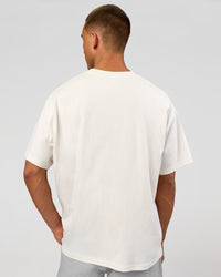 Man wearing Varsity EST Heavyweight Oversized Tee  - Off White-Future Navy | Model:Albert | Size:L