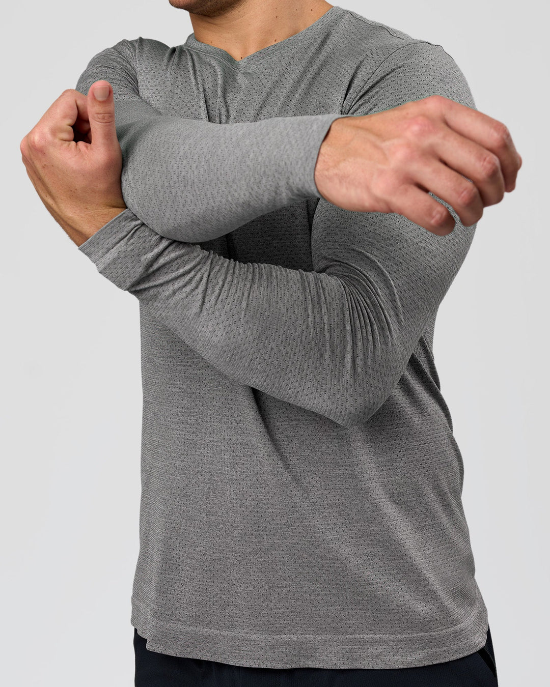 Man wearing AeroFLX+ Seamless Long Sleeve Tee (Set in Sleeve) - Dark Storm/Alloy | Model:Jaiden | Size:L - view 7