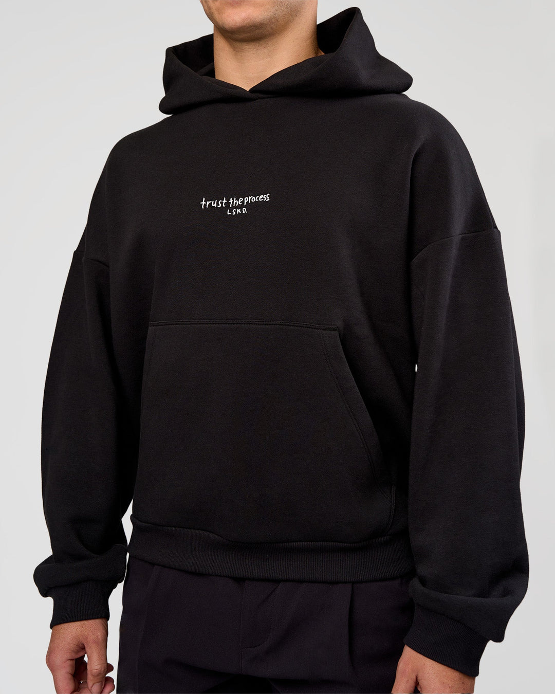 Man wearing Andrew J. Steel x LSKD Boxy Hoodie - Black | Model:Jaiden | Size:L - view 5