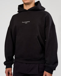 Man wearing Andrew J. Steel x LSKD Boxy Hoodie - Black | Model:Jaiden | Size:L | Thumbnail Index: 4