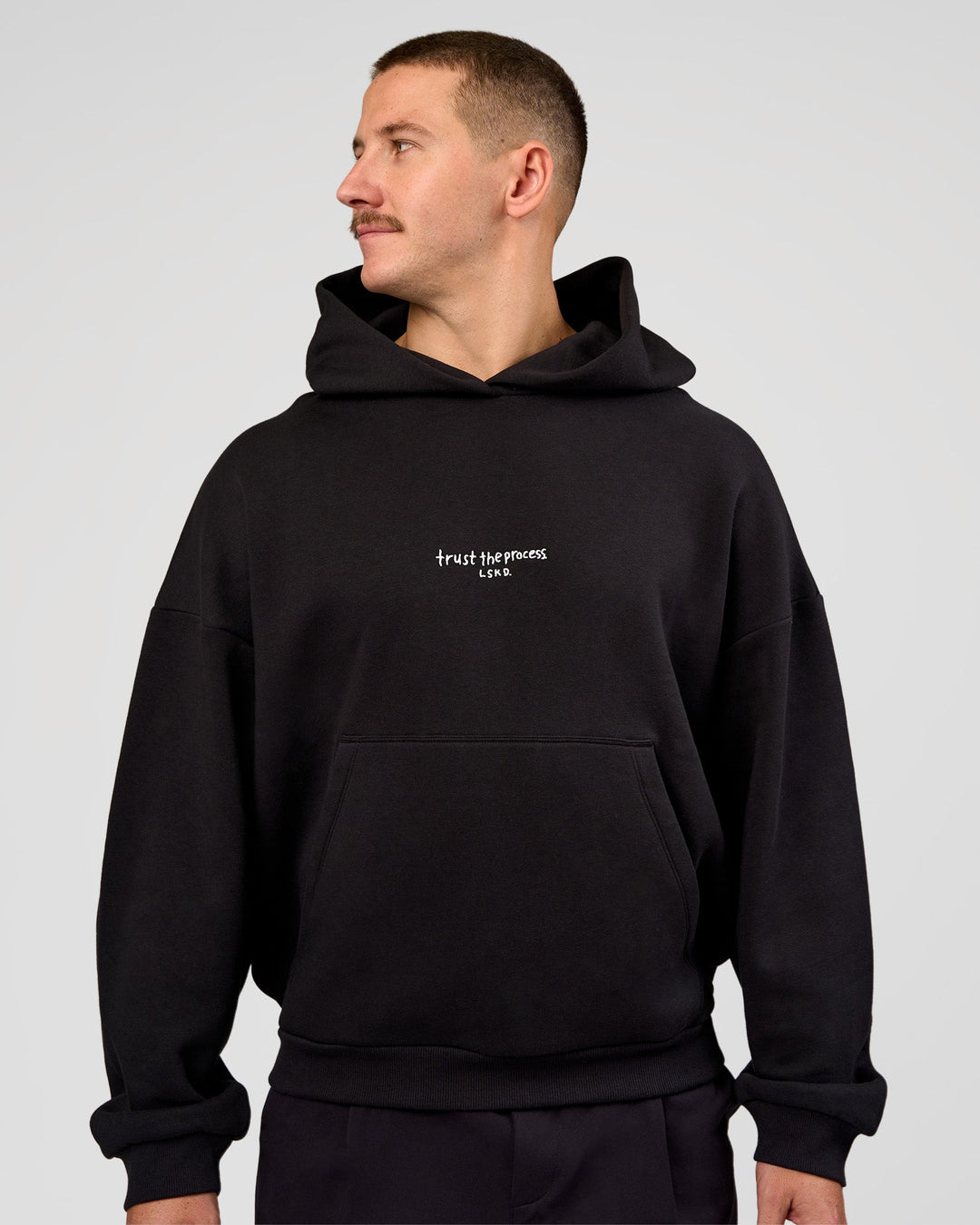 Man wearing Andrew J. Steel x LSKD Boxy Hoodie - Black | Model:Jaiden | Size:L - view 7