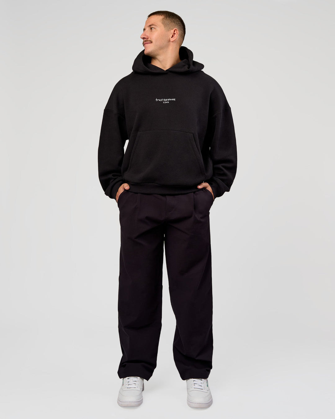 Man wearing Andrew J. Steel x LSKD Boxy Hoodie - Black | Model:Jaiden | Size:L - view 11