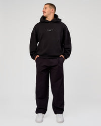 Man wearing Andrew J. Steel x LSKD Boxy Hoodie - Black | Model:Jaiden | Size:L | Thumbnail Index: 10