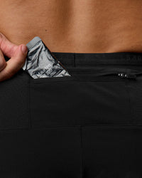 Man wearing Pace 5" Lined Ripstop Short - Black | Model:Jaiden | Size:L | Thumbnail Index: 1