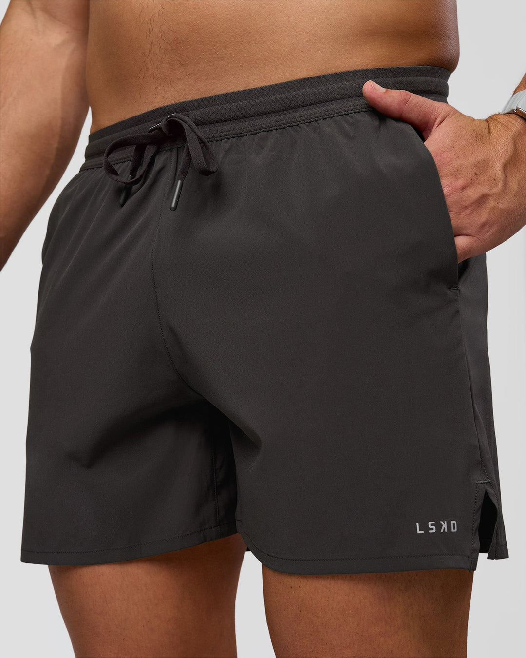 Man wearing Pace 5" Lined Running Short - Black-Onyx | Model:Jaiden | Size:L - view 1