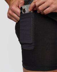 Man wearing Pace 5" Lined Running Short - Black-Onyx | Model:Jaiden | Size:L
