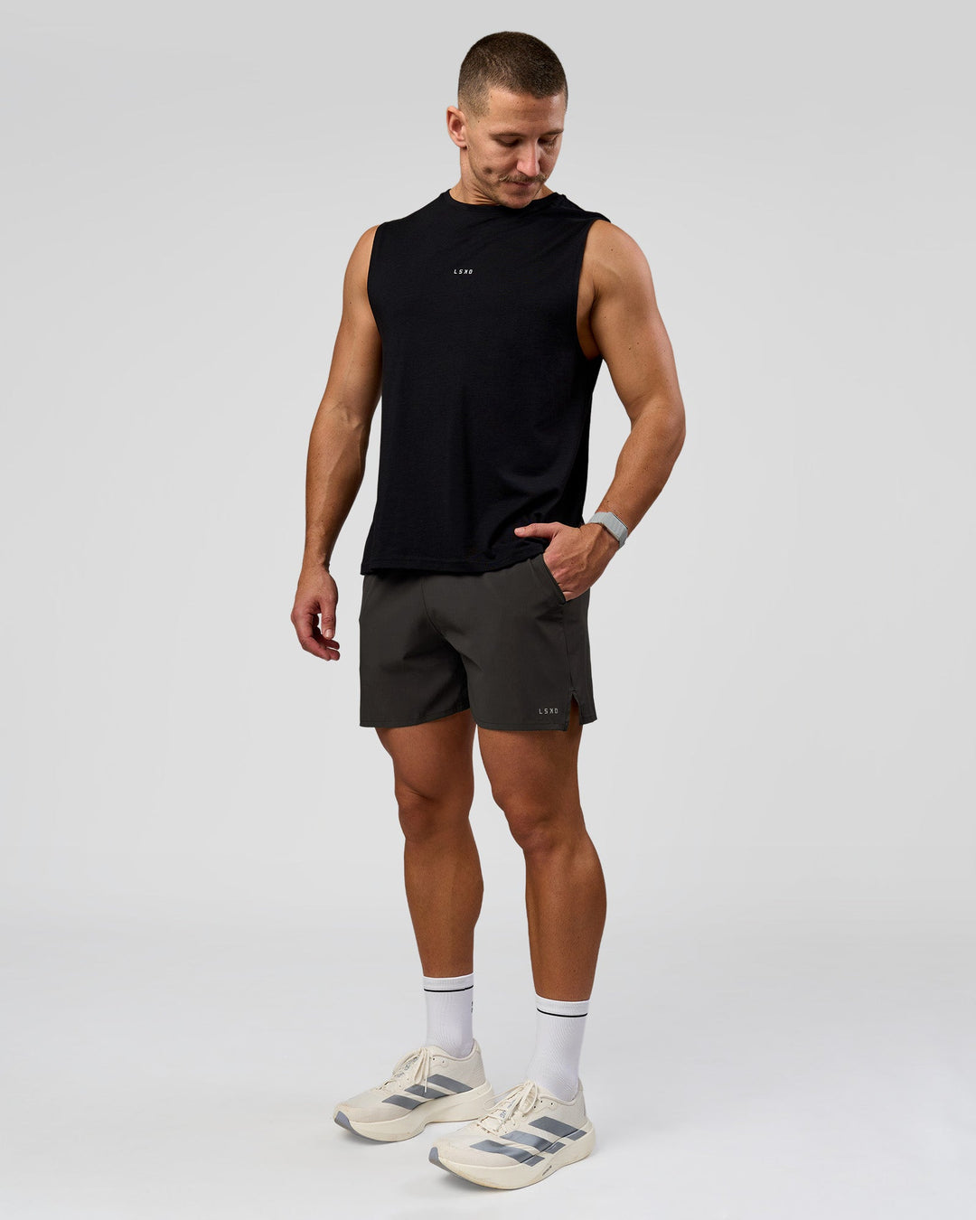 Man wearing Pace 5" Lined Running Short - Black-Onyx | Model:Jaiden | Size:L