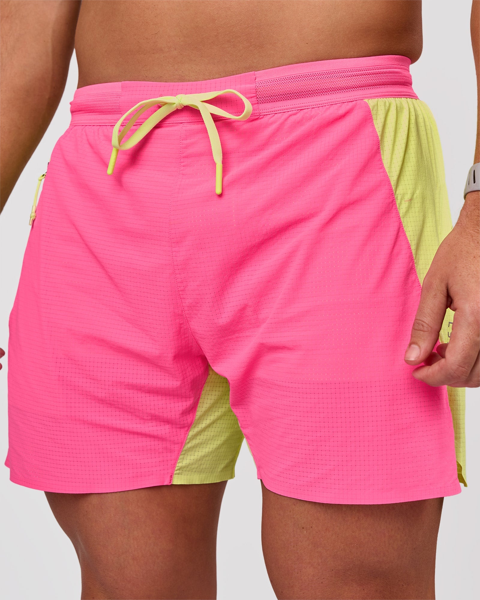Man wearing UltraAir 5" Lined Performance Short - Sugar Plum-Lime Glo | Model:Jaiden | Size:L