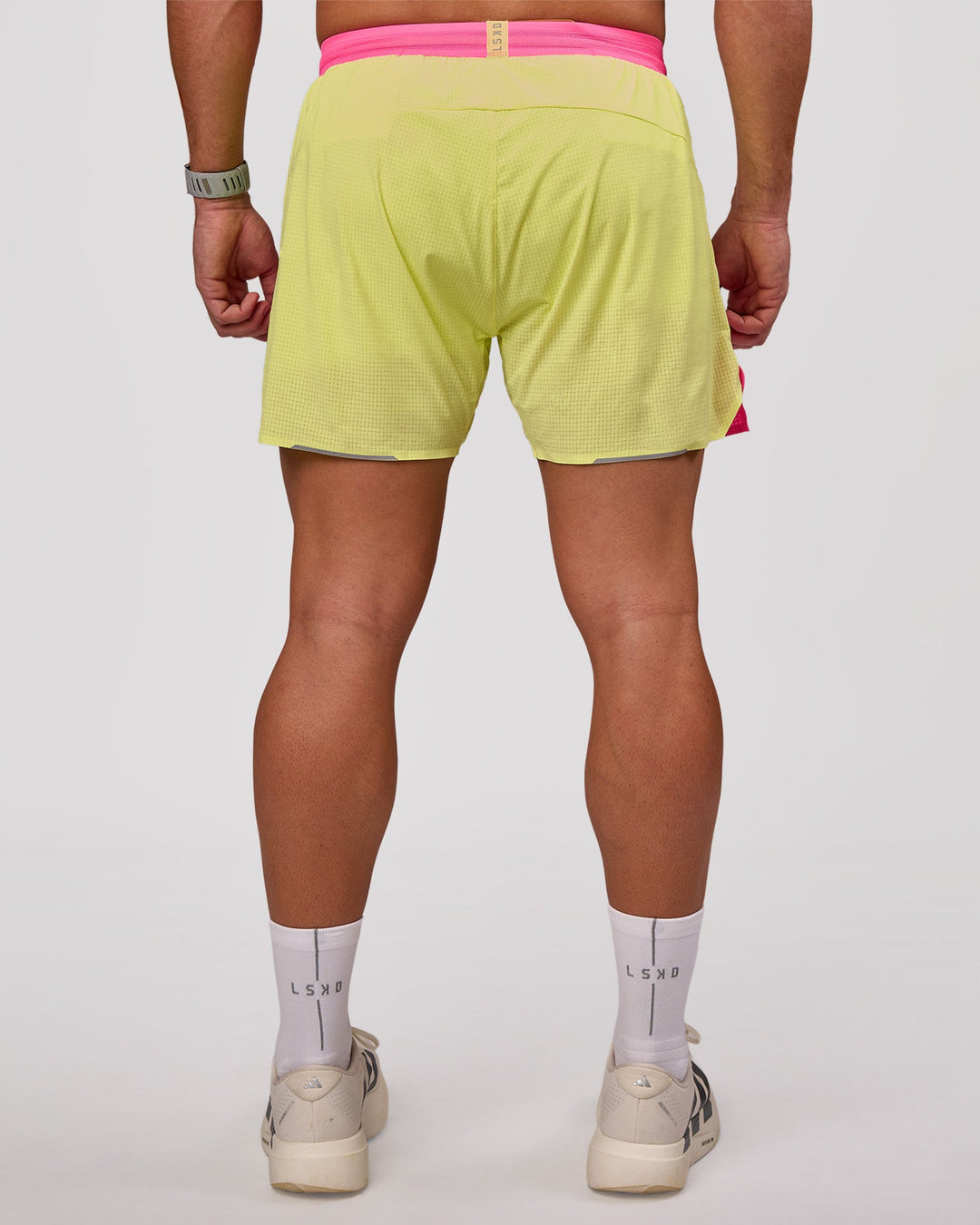 Man wearing UltraAir 5" Lined Performance Short - Sugar Plum-Lime Glo | Model:Jaiden | Size:L - view 3