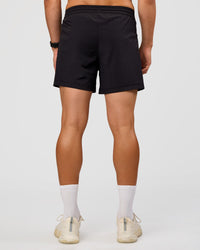 Man wearing Rep 5'' Training Short  - Black | Model:Liam | Size:L