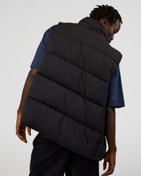 Man wearing Base Puffer Vest - Black | Model:Okello | Size:L | Thumbnail Index: 1