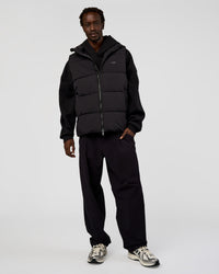 Man wearing Base Puffer Vest - Black | Model:Okello | Size:L | Thumbnail Index: 2