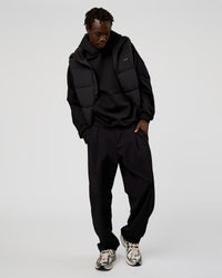 Man wearing Base Puffer Vest - Black | Model:Okello | Size:L | Thumbnail Index: 3