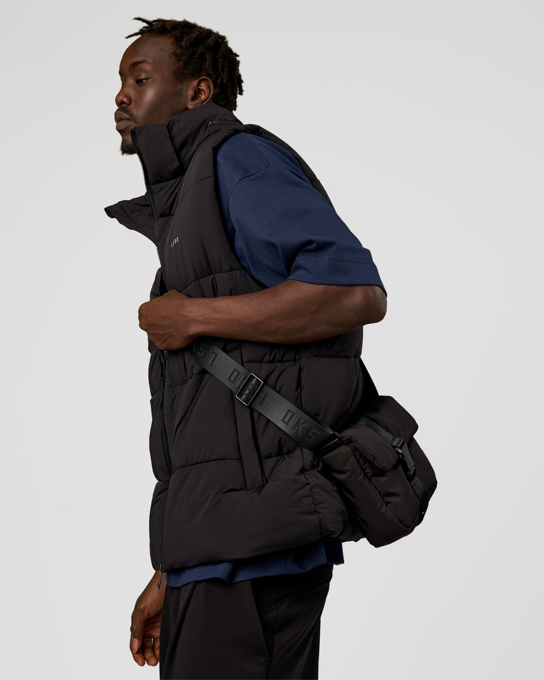 Man wearing Base Puffer Vest - Black | Model:Okello | Size:L - view 8