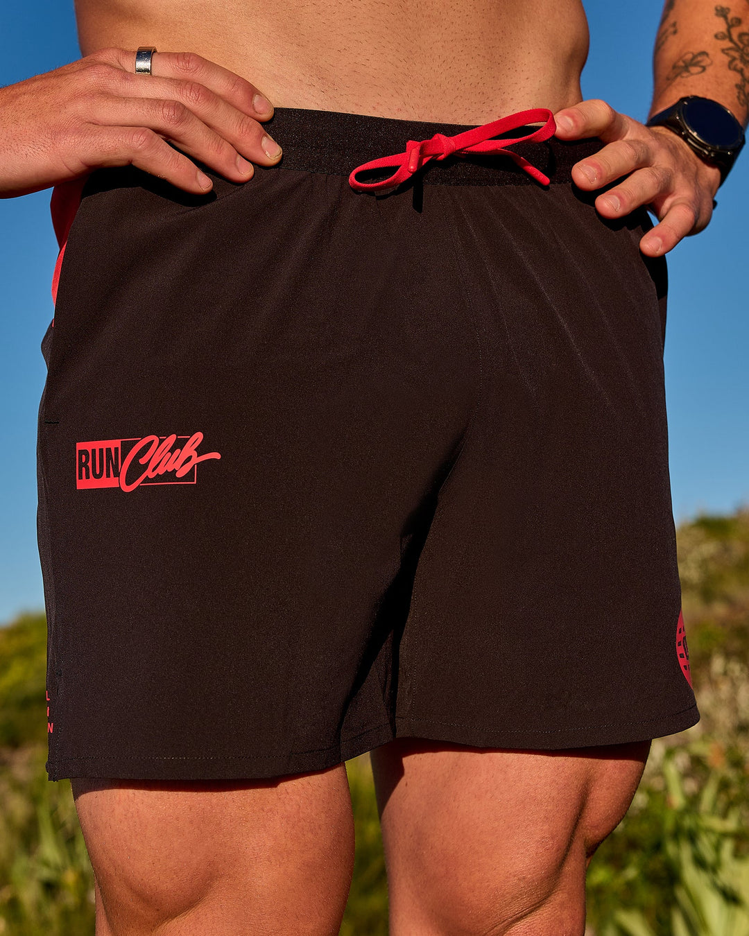 Man wearing Pace 5" Lined Running Short - Black-Scarlet | Model:Riley | Size:L - view 14