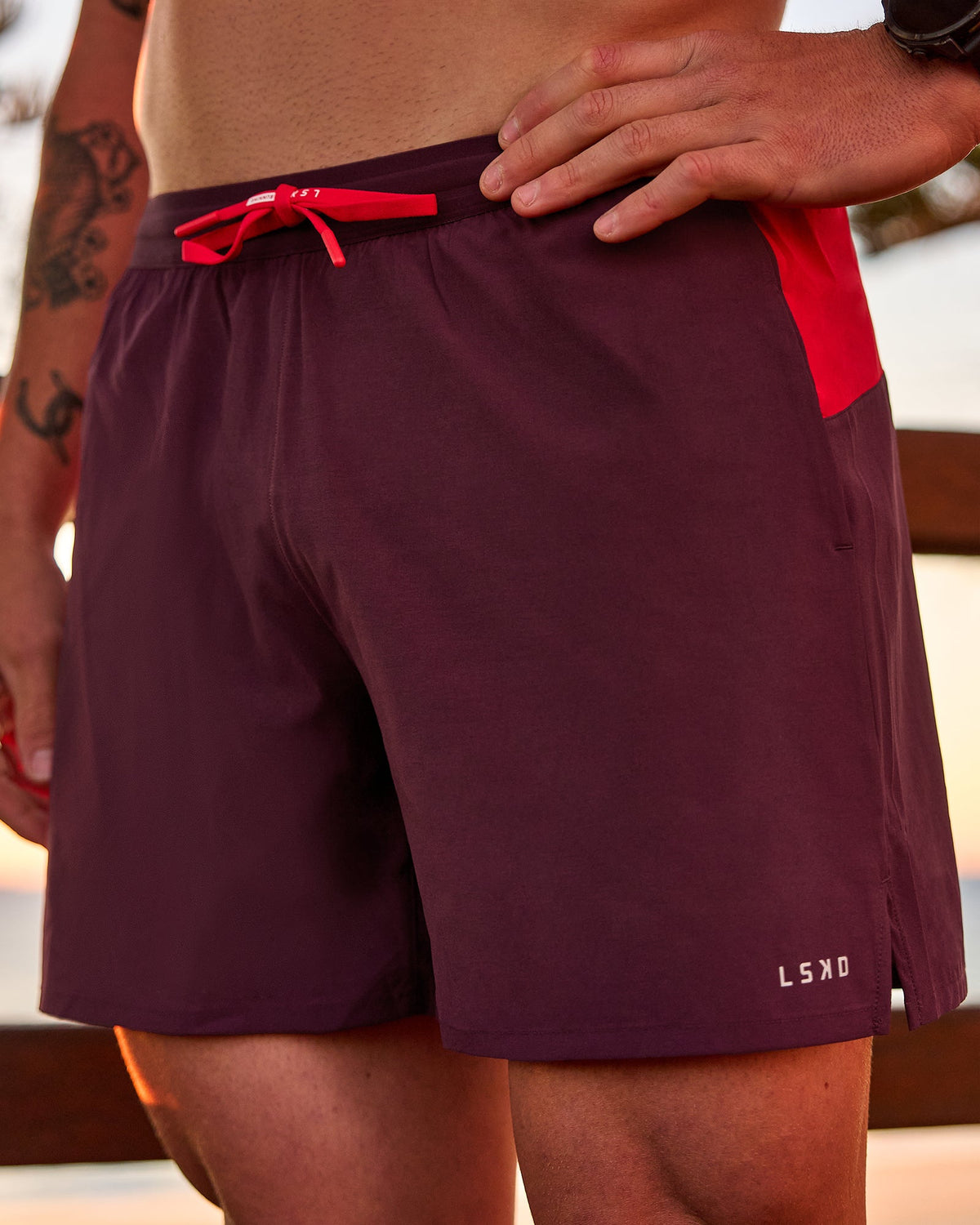Man wearing Pace 5" Lined Running Short - Cherry Lacquer-Scarlet | Model:Riley | Size:L