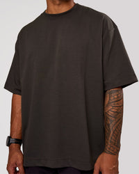 Man wearing AfterDark ZeroCrease Oversized Tee - Onyx | Model:Xav | Size:L | Thumbnail Index: 1