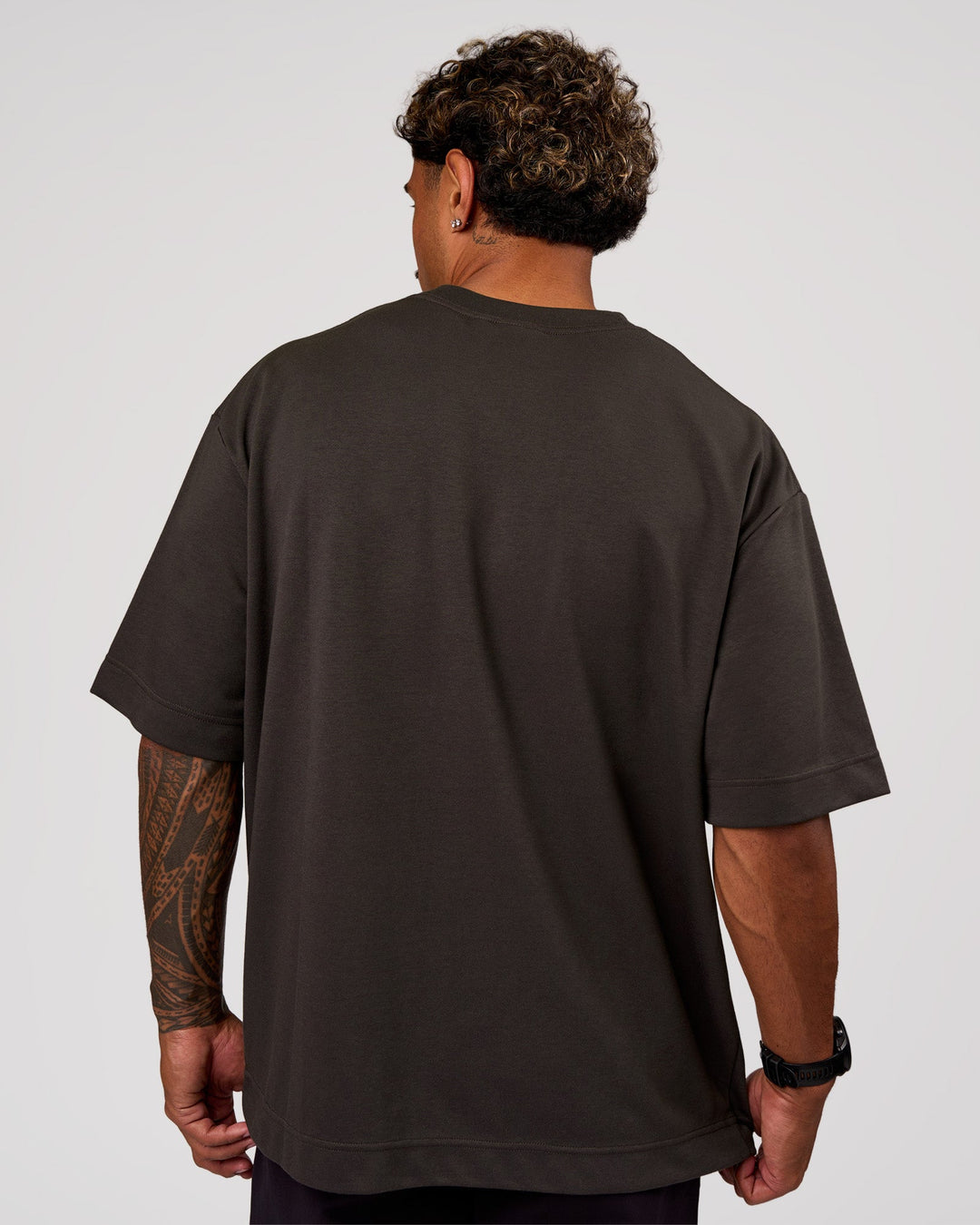 Man wearing AfterDark ZeroCrease Oversized Tee - Onyx | Model:Xav | Size:L - view 4