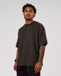 Man wearing AfterDark ZeroCrease Oversized Tee - Onyx | Model:Xav | Size:L | Thumbnail Index: 0
