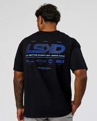 Man wearing Archive FLXCotton Oversized Tee - Black-Electric Indigo | Model:Xav | Size:L | Thumbnail Index: 1