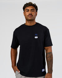 Man wearing Archive FLXCotton Oversized Tee - Black-Electric Indigo | Model:Xav | Size:L | Thumbnail Index: 7