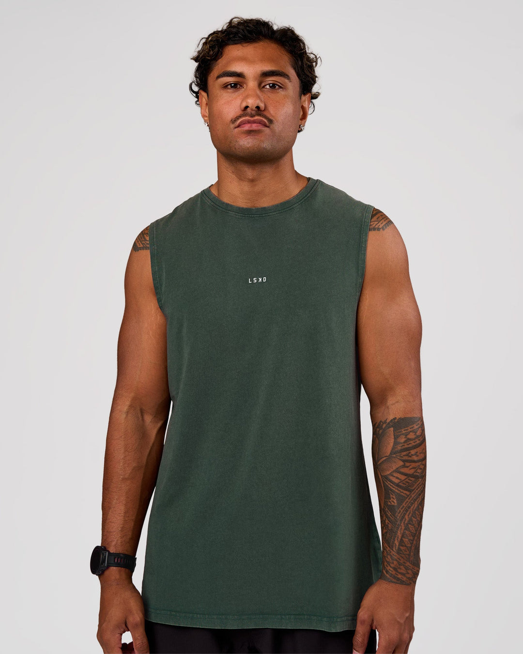 Man wearing Base FLXCotton Tank - Midnight Green Washed | Model:Xav | Size:L - view 1
