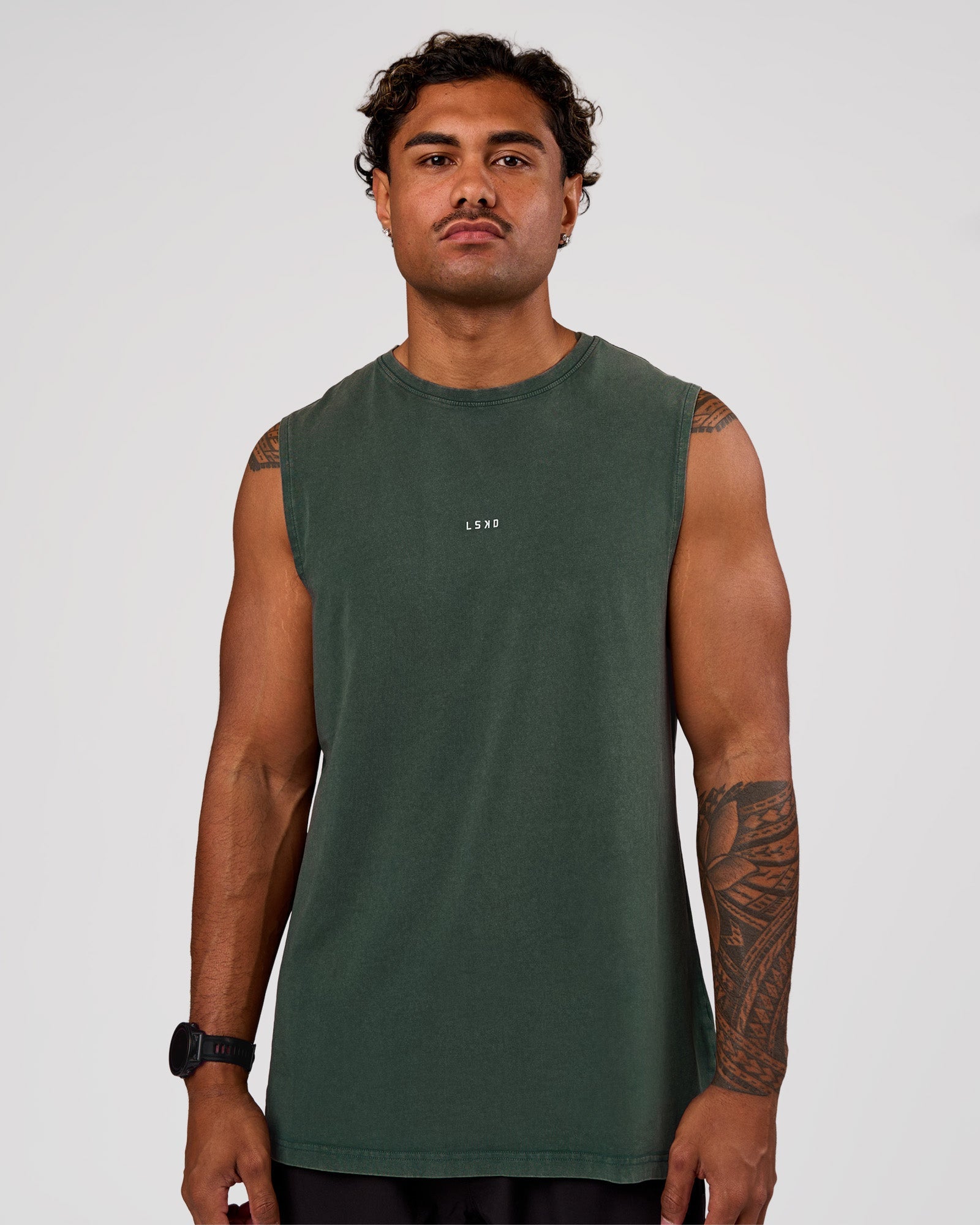 Man wearing Base FLXCotton Tank - Midnight Green Washed | Model:Xav | Size:L