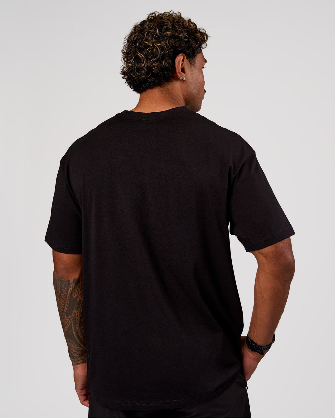 Man wearing Base FLXCotton Tee Oversized - Black | Model:Xav | Size:L - view 3