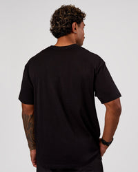 Man wearing Base FLXCotton Tee Oversized - Black | Model:Xav | Size:L | Thumbnail Index: 2